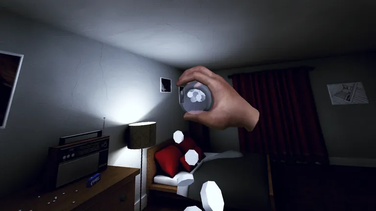 The player shakes a snow globe in a motel bedroom with a radio and a lamp