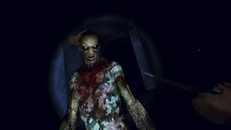 A zombie in a camouflage shirt looms close in a torch-lit tunnel